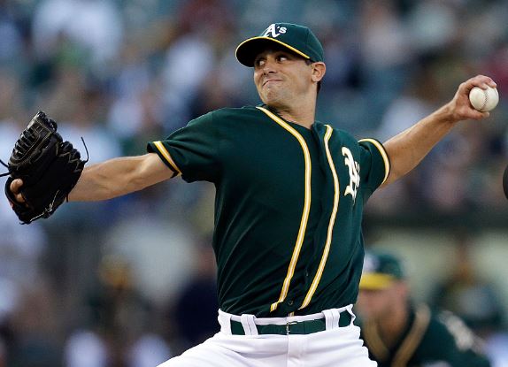Brad Mills pitching for the Oakland A's in 2014